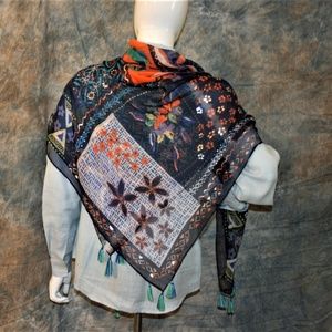 This scarf if a beautiful accent to an outfit